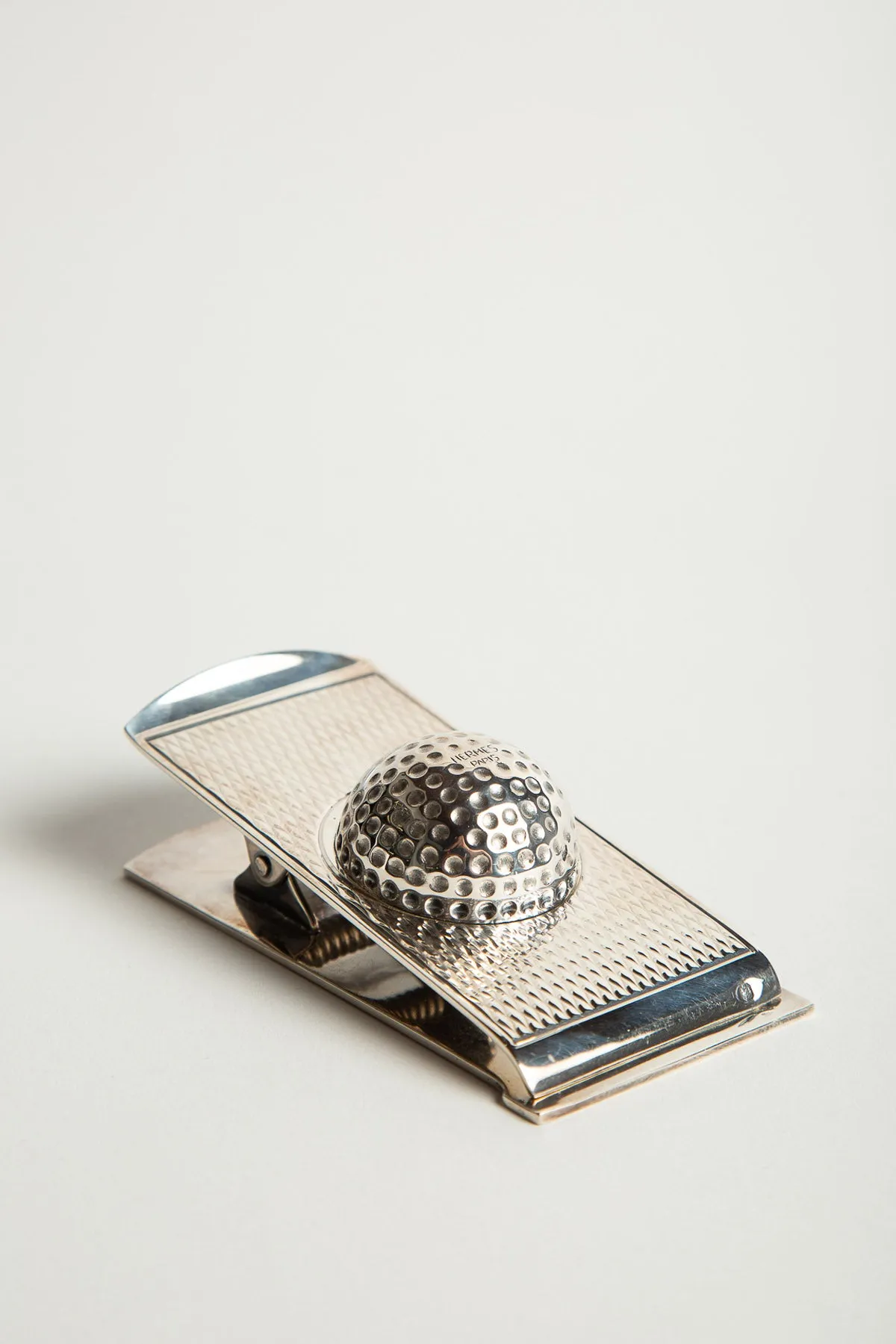 HERMÈS | 1960'S SILVER GOLF BALL PAPER CLIP